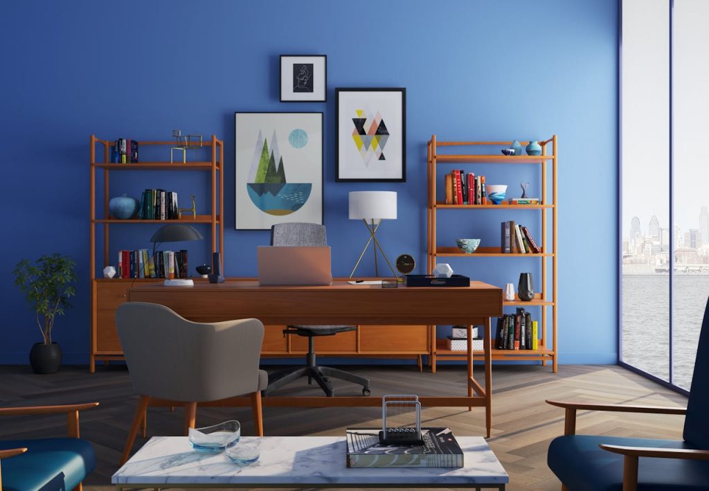 Elegantly decorated home office with modern furniture and a blue wall
