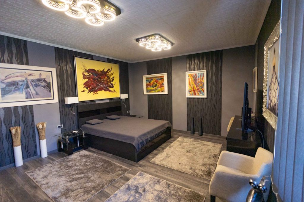 Stylish modern bedroom with abstract wall art and elegant lighting